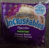 Smucker's Uncrustables Peanut Butter & Grape Spread Sandwich on Wheat Bread